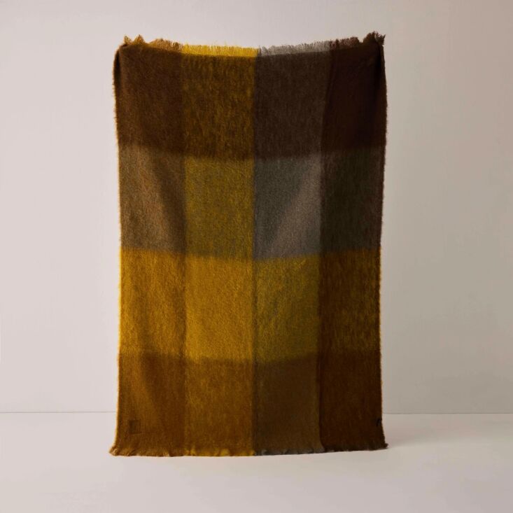 Woven from wool and mohair, this throw captures the pigments of late autumn. We\2\17;d love it draped over the sofa or laid atop the bed. Shop now.