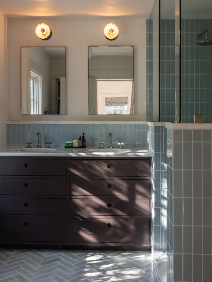the primary bath, with vanity by bench dogs. the blue wall tiles are from firec 26