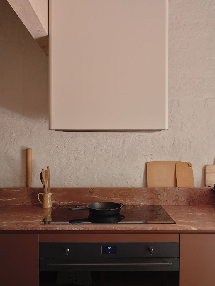 clay red, cream, and pale green dominate the palette. the brick walls were give 21