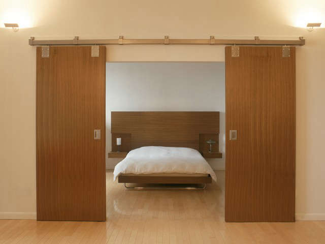barn doors reveal a bed for the barlow lawson apartment: click here for more in 66