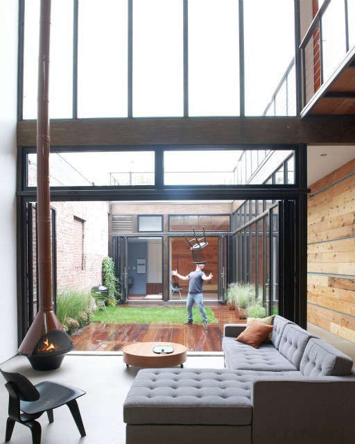 atrium house: this house began as a one story workshop that occupied the entire 8