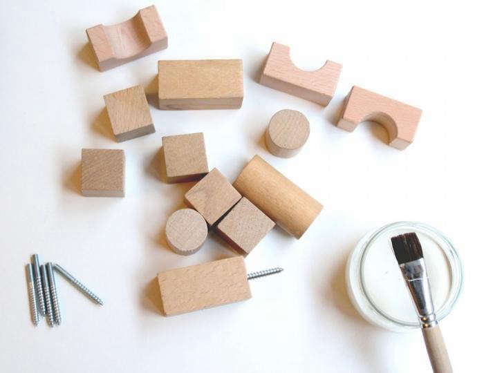 to create shelf brackets and wall hooks, consider wooden building blocks&# 21