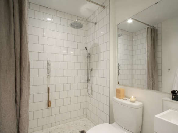 Bathroom of the Week In Brooklyn Heights An Ethereal Bath in White Concrete portrait 41