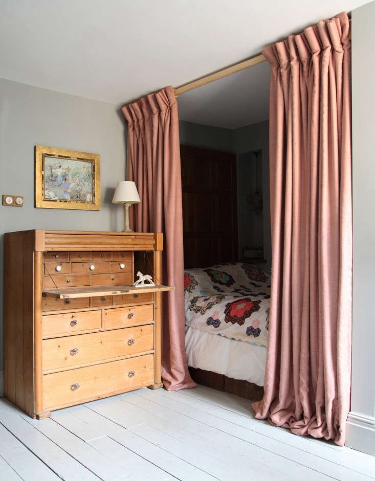 an alcove bed fitted with pale pink dress silk curtains and a quilt in patrick  12