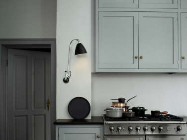 blue gray kitchen black sconce  