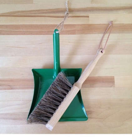 green dustpan and brush  