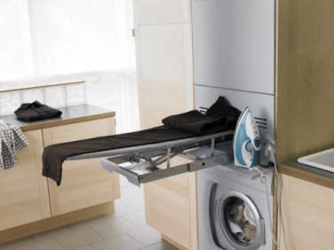 maytag ironing board in laundry room concept  