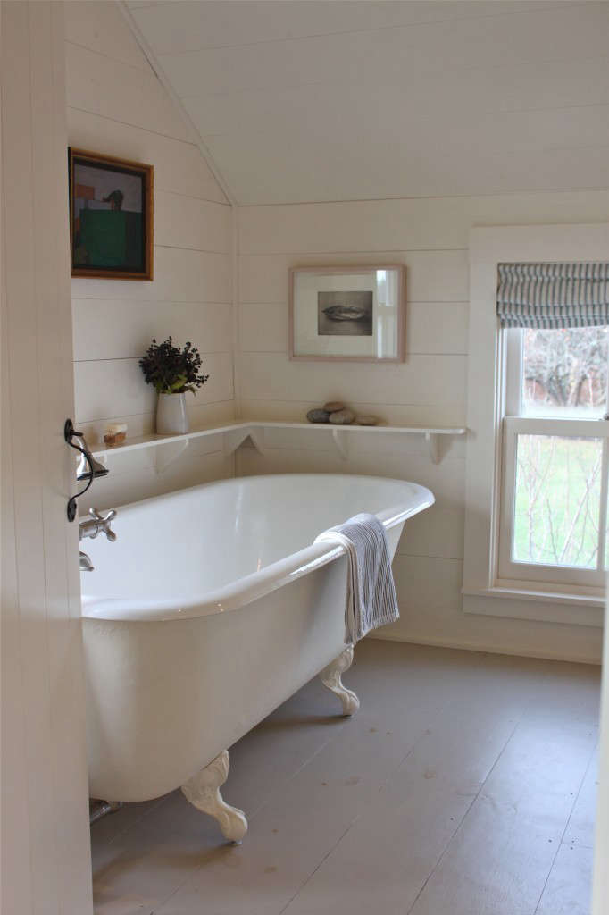 a claw foot bath in a cottage reborn in coastal maine. photograph by& 16