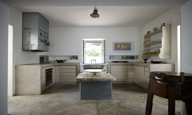 A kitchen area with thick concrete counters by designer Theodore Zoumboulakis; see Kitchen of the Week: A Greek Architect’’ s Ode to Minimalism.