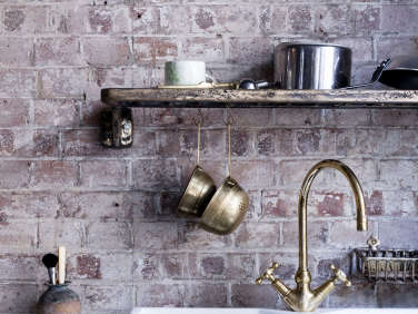 Mark Lewis Interior Design Hoxton Square loft kitchen old brick brass faucet Rory Gardener photo 4  