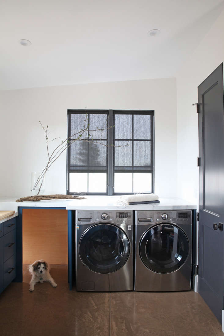 Dark gray roller shades paired with dark gray window frames in a laundry room featured in In California Wine Country, A Modern Farmhouse for a Brit and a Texan. Photograph by Karen Steffens for Remodelista.