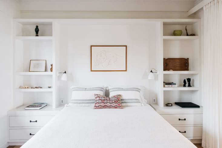in a second bedroom, built in shelving doubles as nightstands. 20