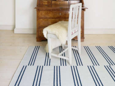 nordic knot ake striped rug blue  