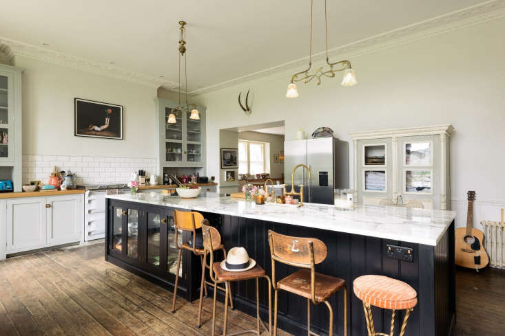Quirky English country kitchen with black island by deVOL for Pearl Lowe