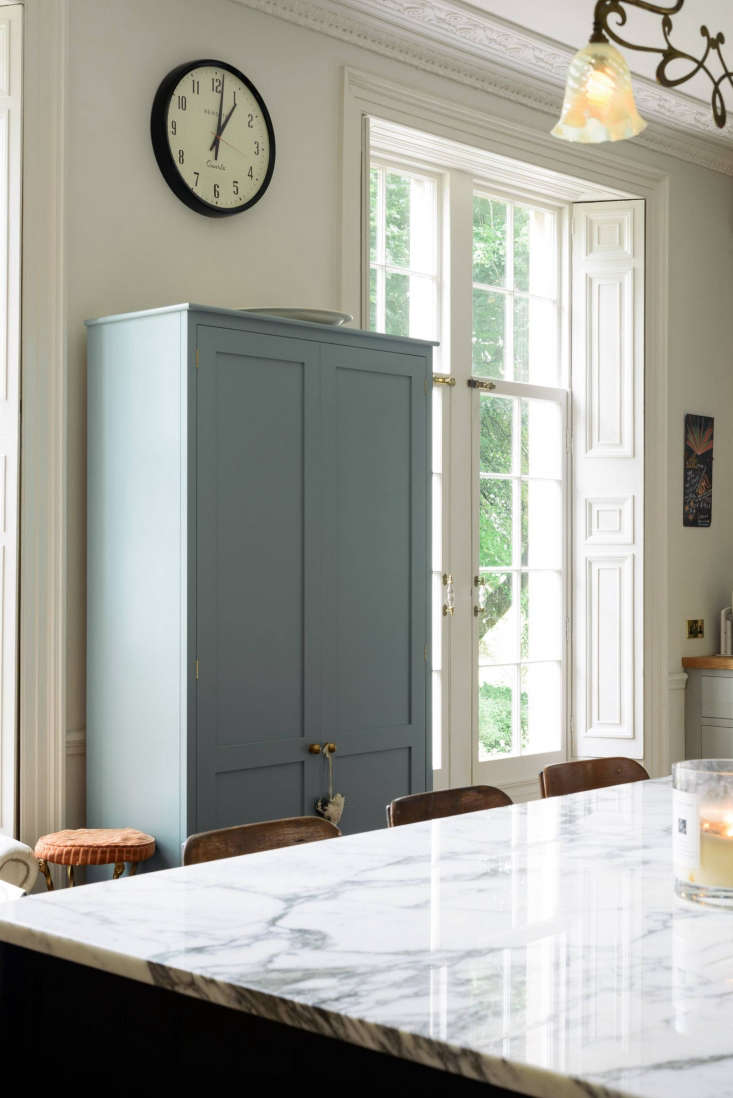 Blue custom cabinet in quirky English Country kitchen by deVol for Pearl Lowe