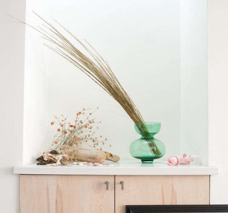 artwork cabinet dried grass green vase sophia moreno bunge cropped cover