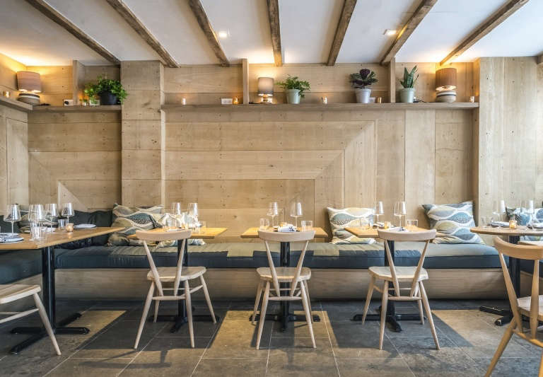 ferris restaurant interior nyc pale wood blue cushions  
