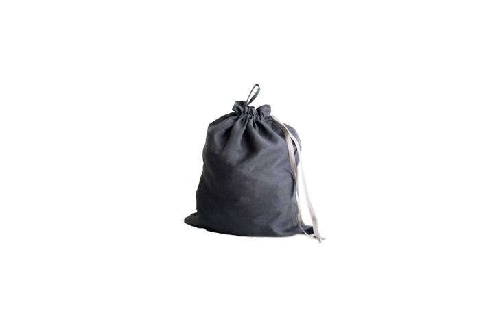 Source a linen drawstring bag from Etsy, like this Large Linen Laundry Bag in gray, available for \$40.87 from Cozy Linen.