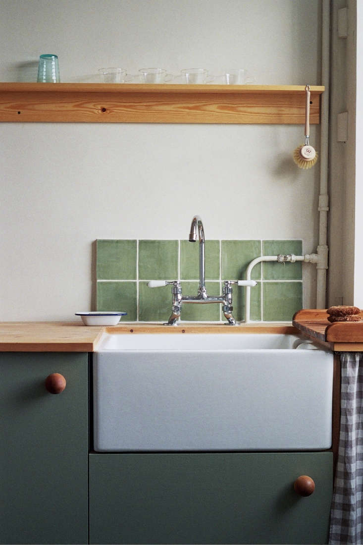 instead of tiling the entire wall above the kitchen counter, consider the cost  12