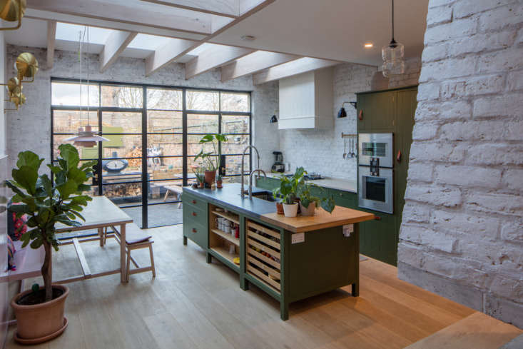 the kitchen, with steel framed doors that lead directly into the terrace garden 9