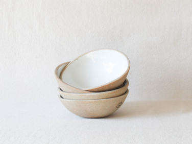 the pottery studio speckled glossy white bowls  