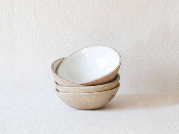 the pottery studio speckled glossy white bowls  