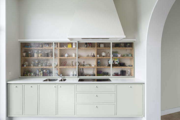 the kitchen cabinets and vent hood were designed by the architects, made bespok 14