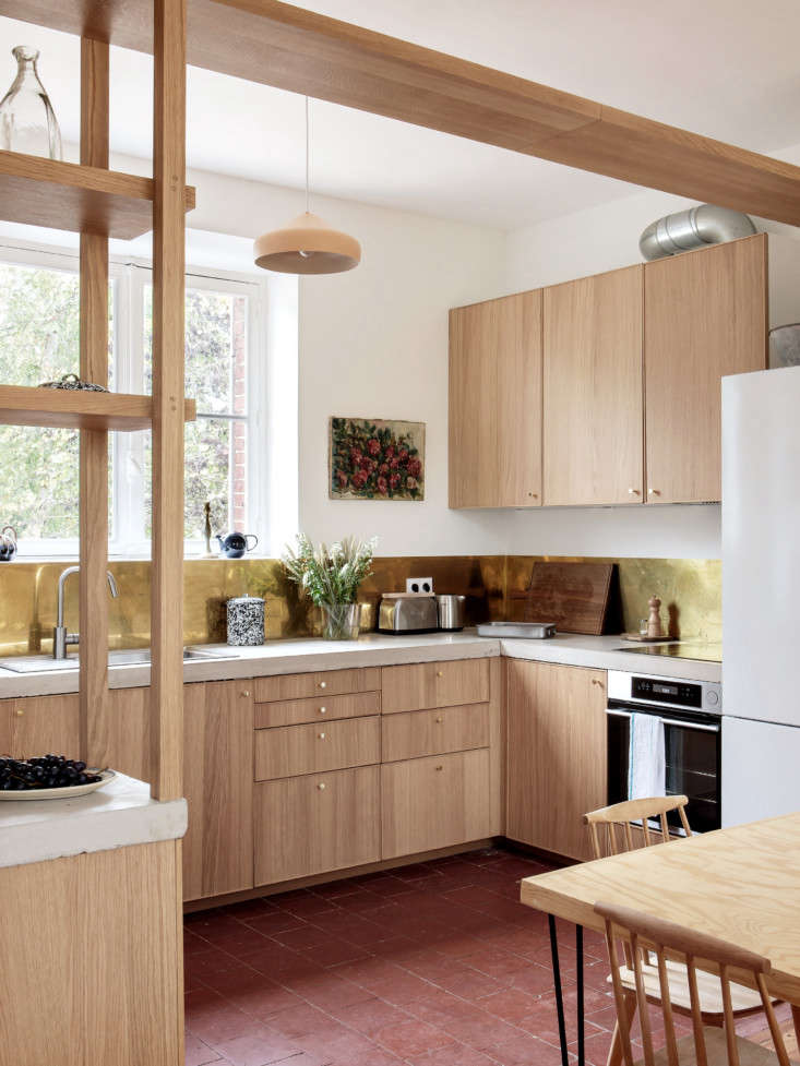 the kitchen itself is a high low mix: ikea cabinetry pairs with custom concrete 13
