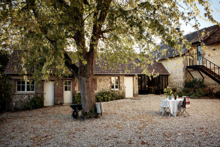 outside, a pea gravel courtyard—surrounded by stone outbuildings, the re 15