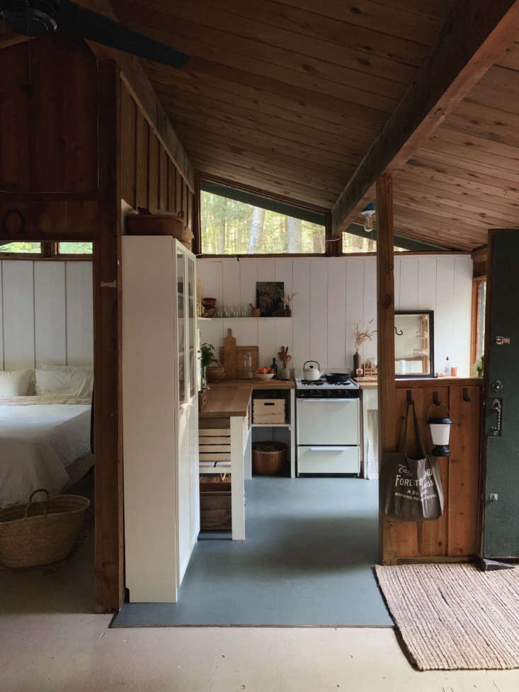 inside the small cabin, with the newly rehabbed kitchen straight ahead. 10