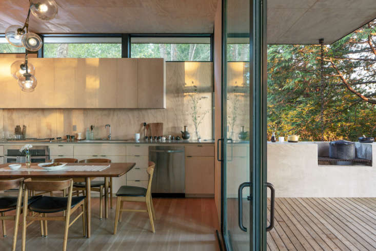 in the main cabin, floor to ceiling windows and sliding doors lend a feeling of 9