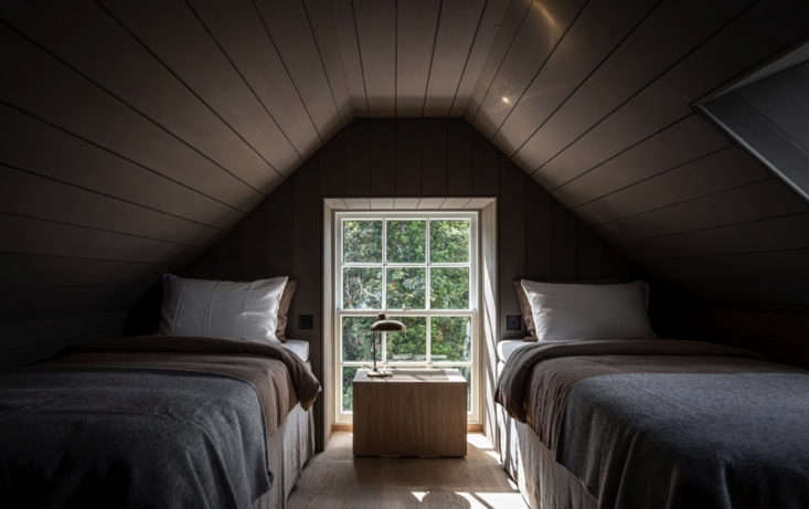 snug accommodations under the eaves at lundies house in scotland. for more, see 9