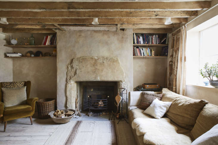 A snug favorite. Photograph by Tom Fallon, courtesy of Retrouvius, from A Rustic Townhouse Remodel by London’s Masters of Salvage.