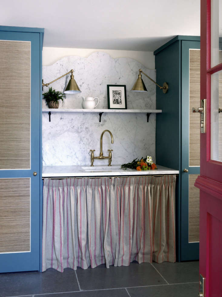 in a sussex cottage, beata heuman skirted the utility sink with striped linen a 11