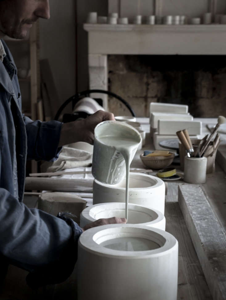 jean pours liquid clay into a slip cast mold for a cup. epure is currently just 23