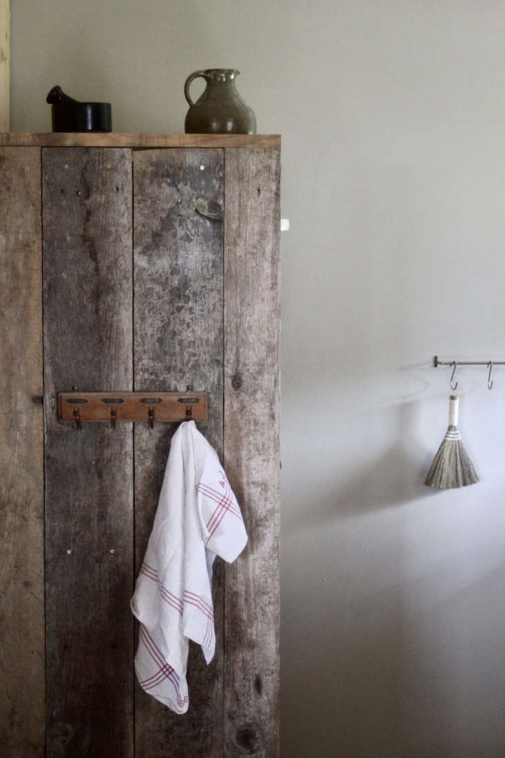 jean built the food cupboard from weathered old wood. the painted walls downsta 15