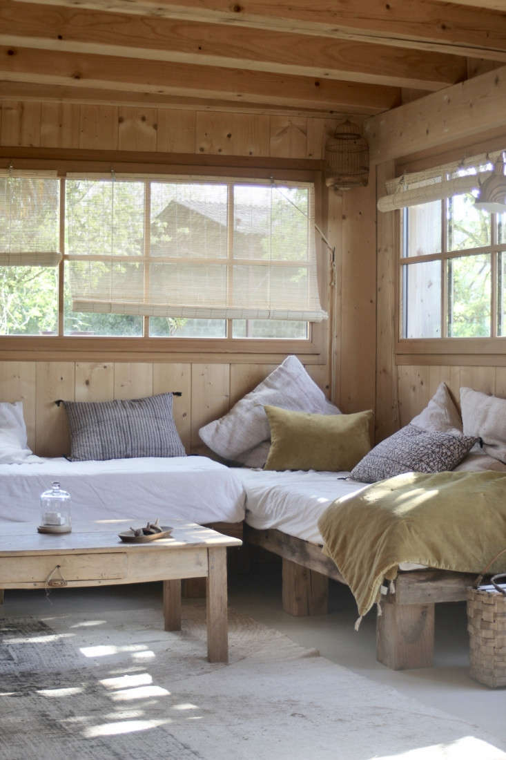 jean built the living room daybeds out of wood from the old roof, and the coupl 11