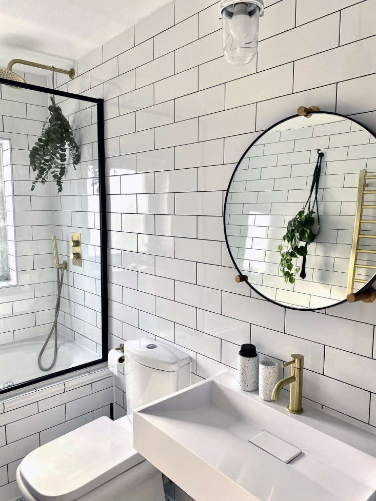 Ferren Gipson's white-tiled bathroom remodel, London.