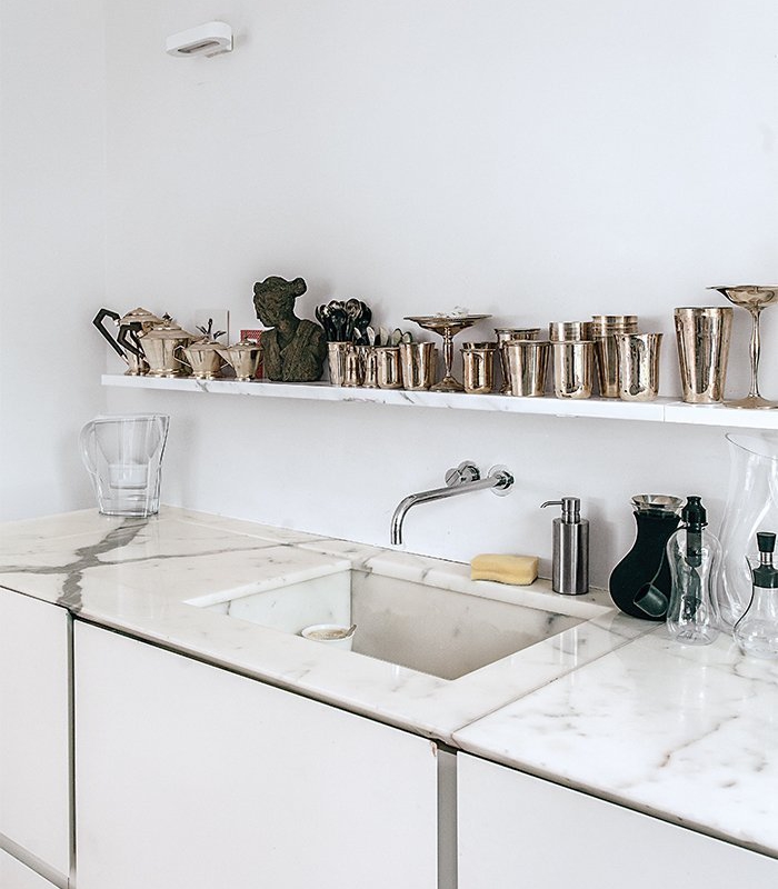 tiny london apartment renovated kitchen with vola faucet and marble countertop  