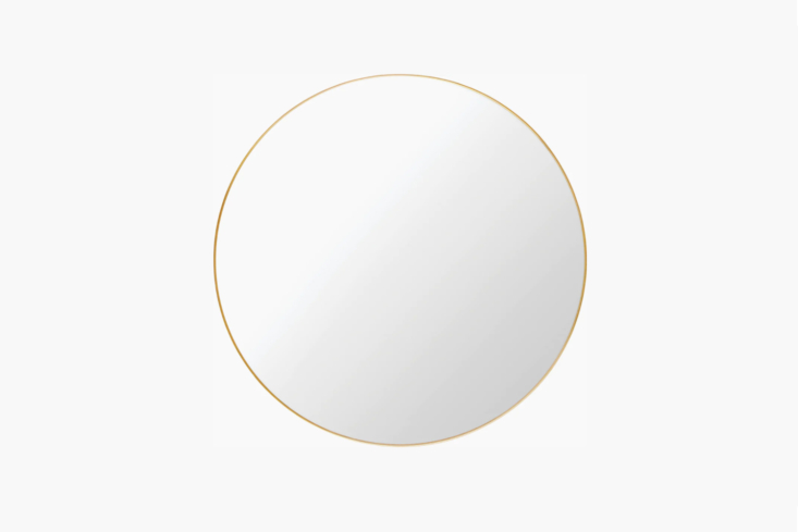 the gubi wall mirror in polished brass is \$\1,999 at design within reach. for  20
