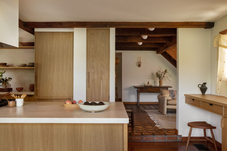 Before and After A Summery Bungalow in Topanga California Redone by an LA Designer Into the redone kitchen, with oak millwork by LA based EB Joinery.