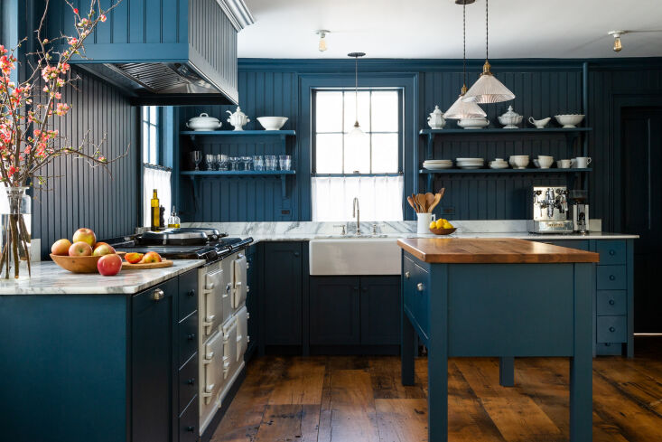 in the kitchen, the couple designed the shaker cabinetry themselves and trimmed 10