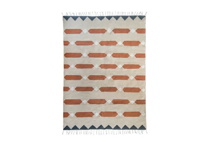 the terracotta and blue bricks rug is made from 100 percent wool on a cotton b 9