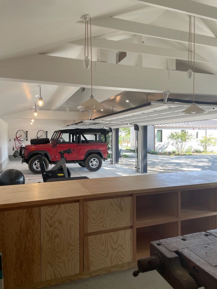 in addition to housing vehicles, the redesigned four car garage holds a gym and 9