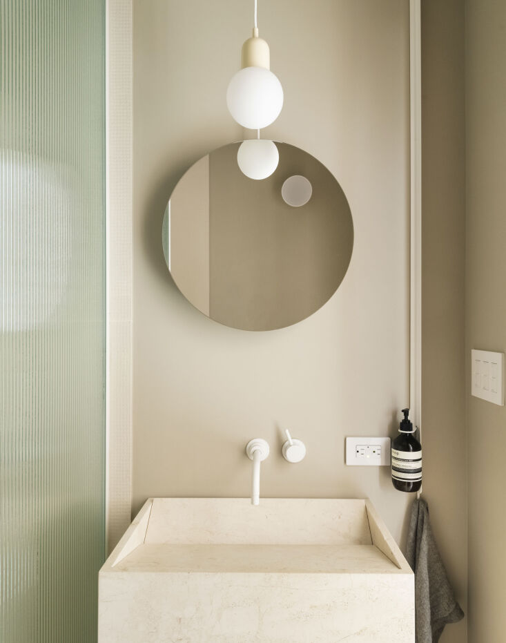 the compact bathroom has a stone vasco colonna basin from salvatori and wall mo 19