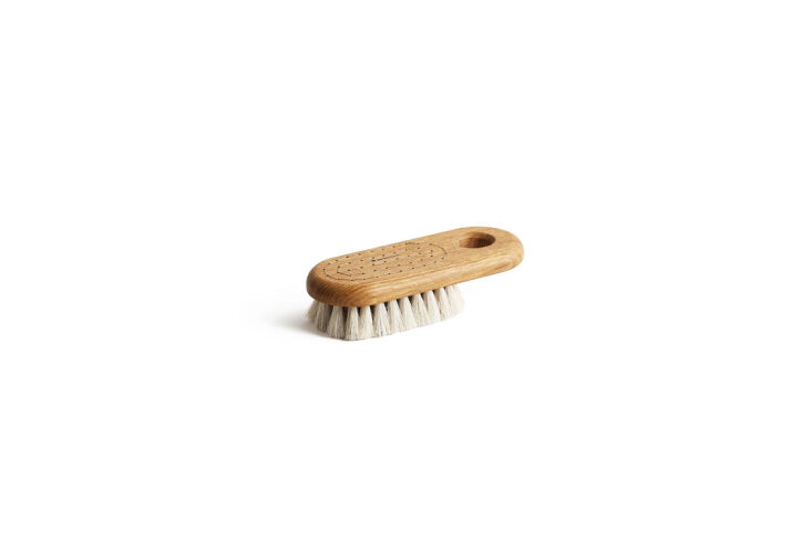 the oak handheld bath brush by iris hantverk (center) is \$3\2 from boston gene 24