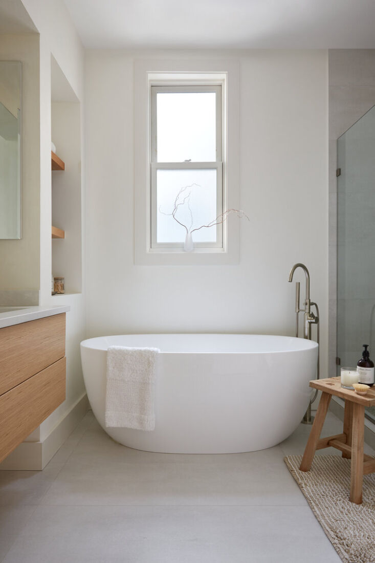 the primary bathroom has a luxurious freestanding soaking tub from eisen home. 29