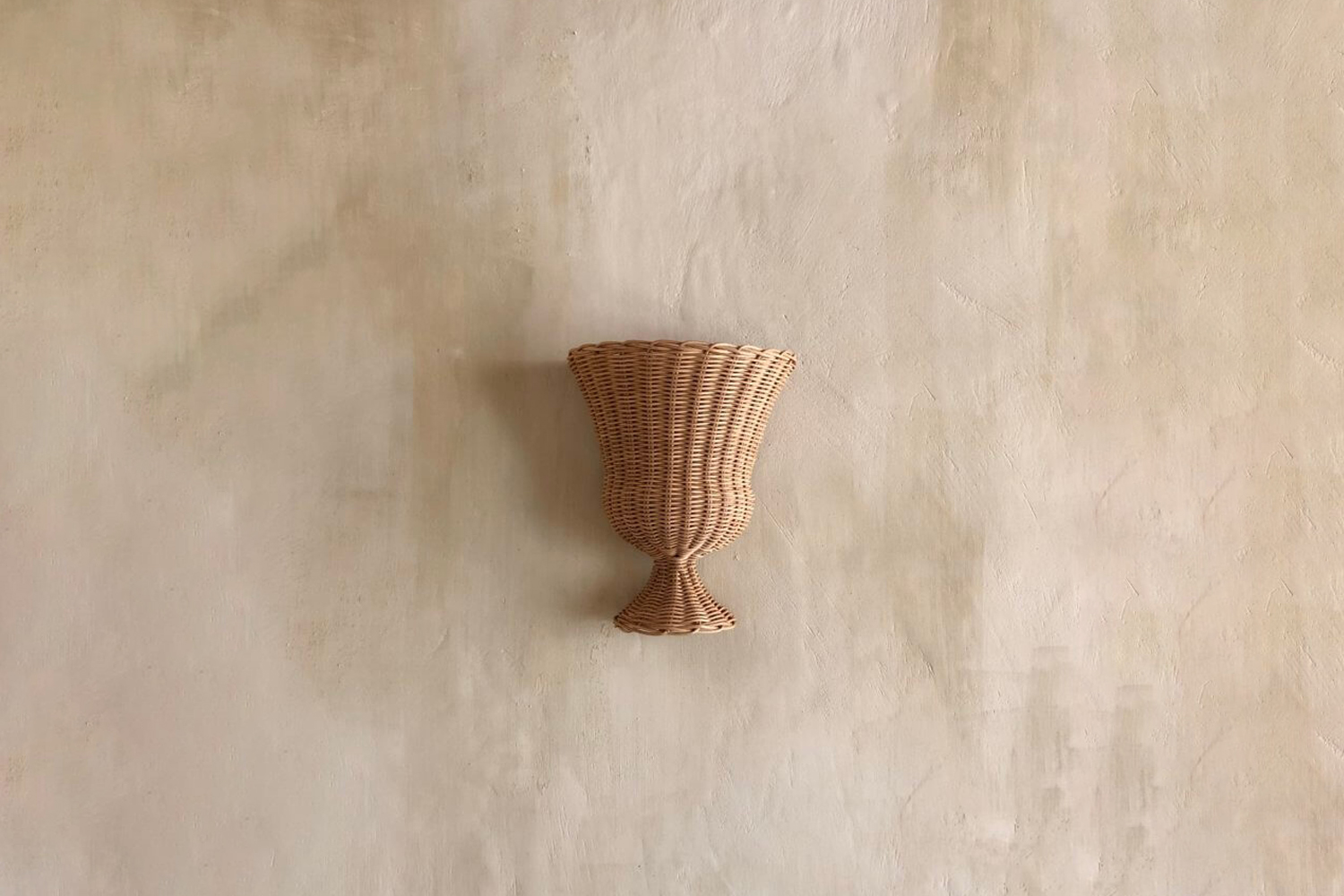 the atelier vime medici sconce is handmade of rattan in france; €880 at  20