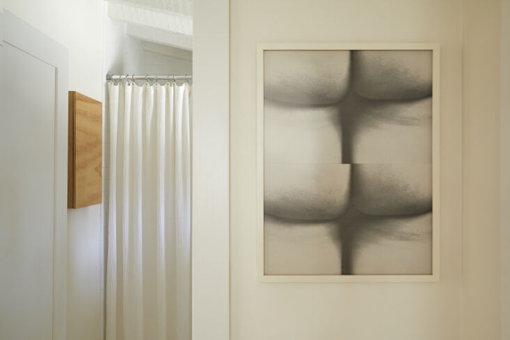 a print of yoko ono and george maciuna&#8217;s fluxus wallpaper hangs in  14