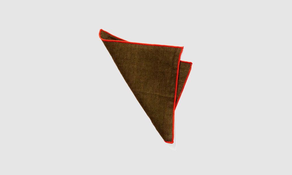 the avocado napkin with red trim, shown here in tiny size. 11
